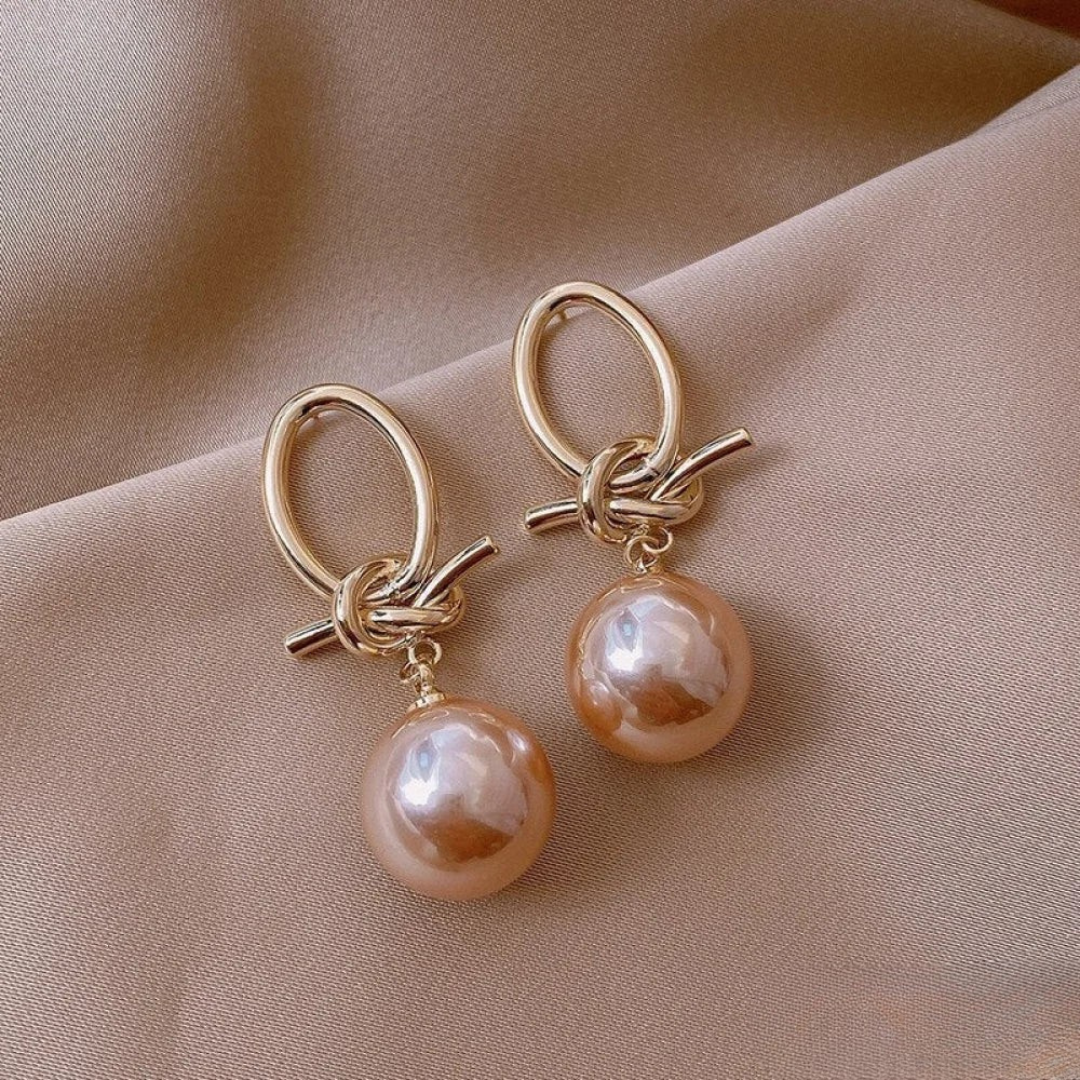 Boucles d’oreilles anneaux dorés avec perle