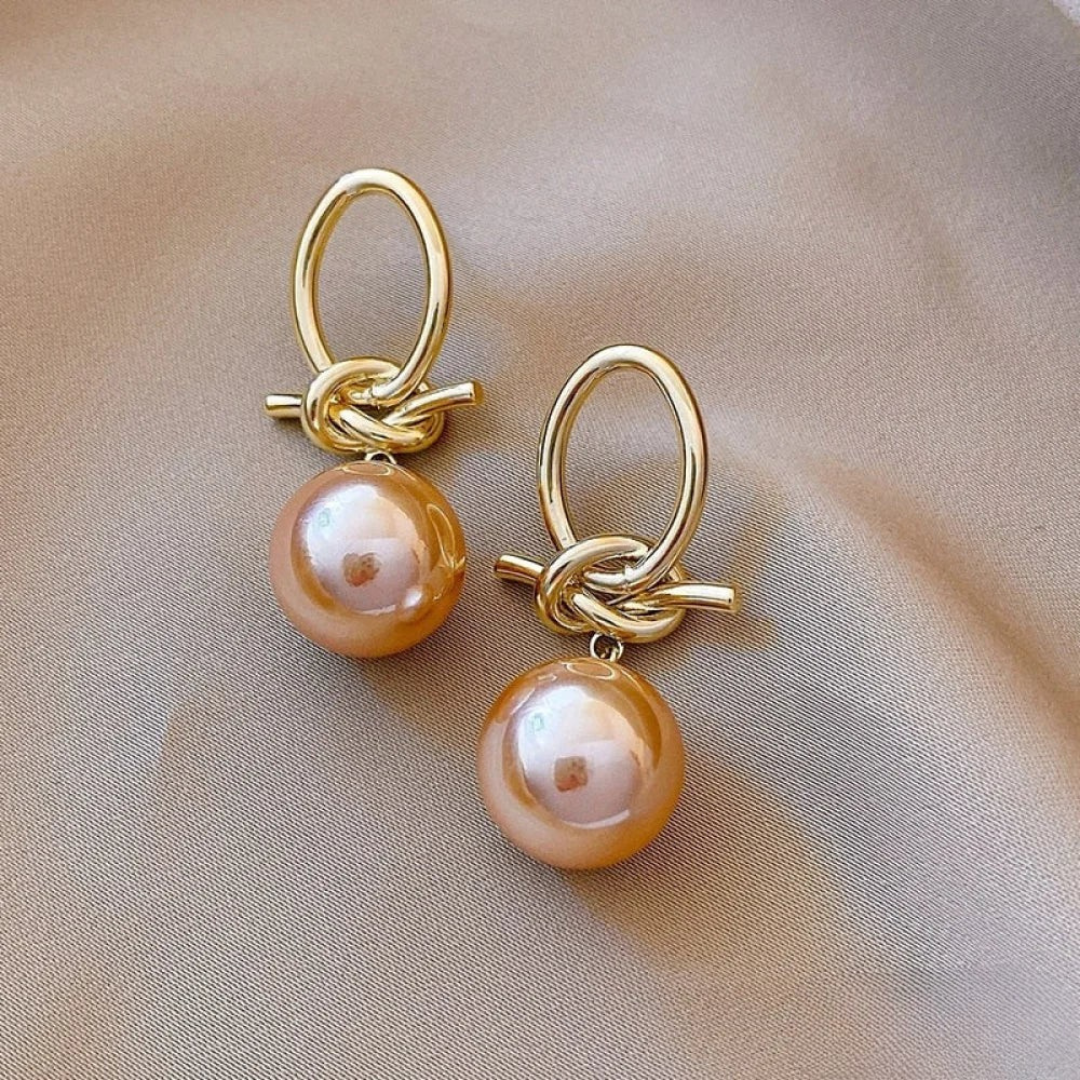 Boucles d’oreilles anneaux dorés avec perle