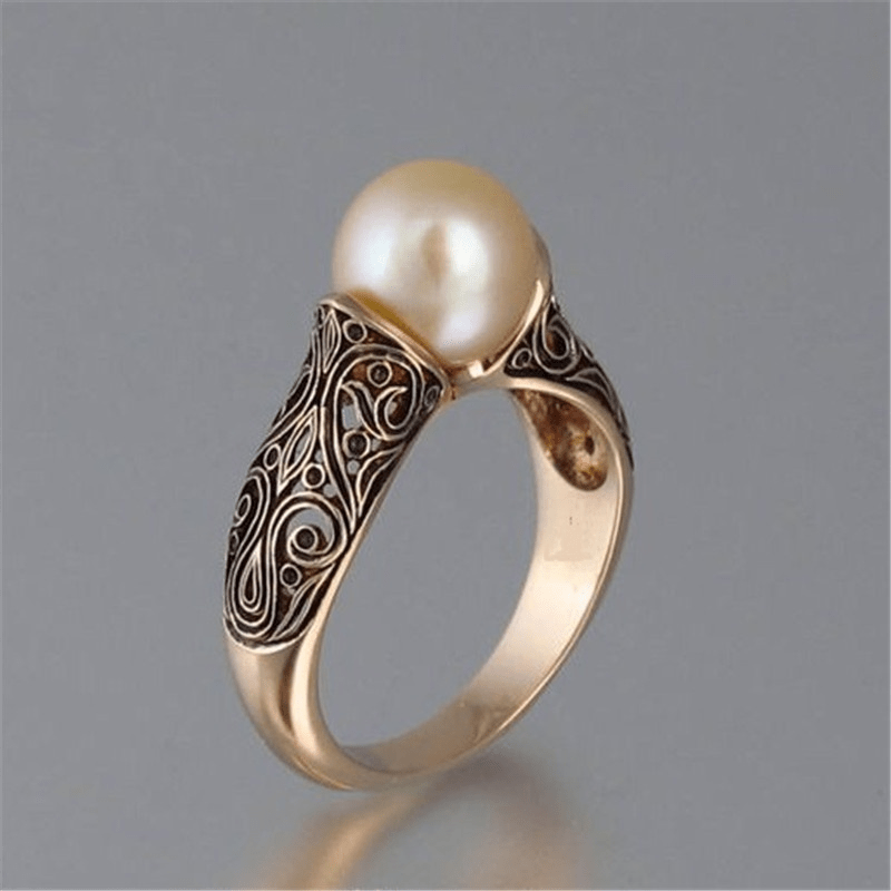 Bague vintage dorée avec perle