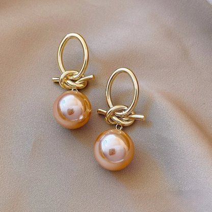 Boucles d’oreilles anneaux dorés avec perle