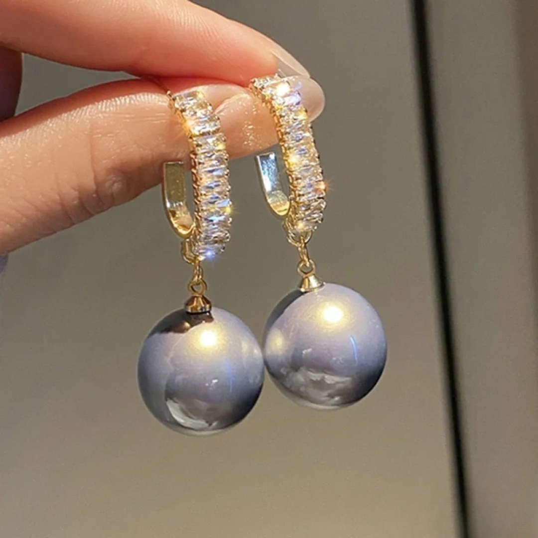 Boucles d’oreilles luxueuses en perles et zirconium