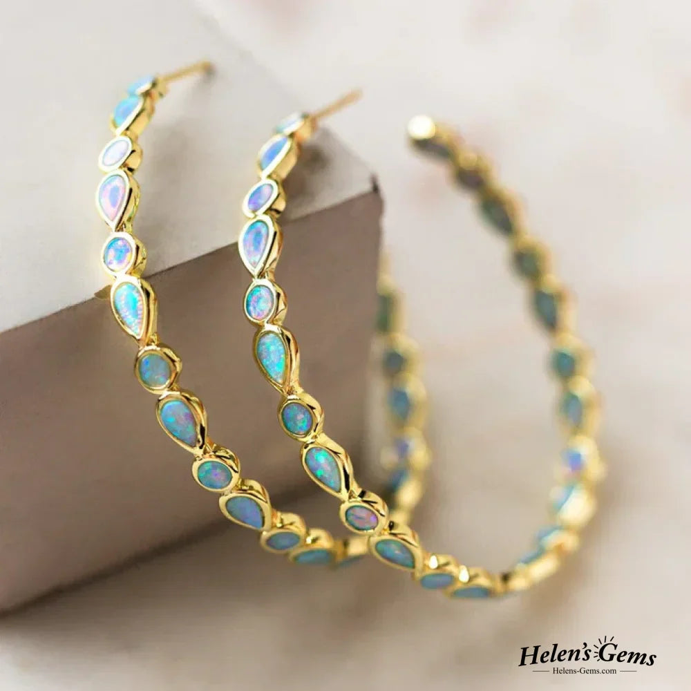 Créoles dorées vintage avec opale bleue